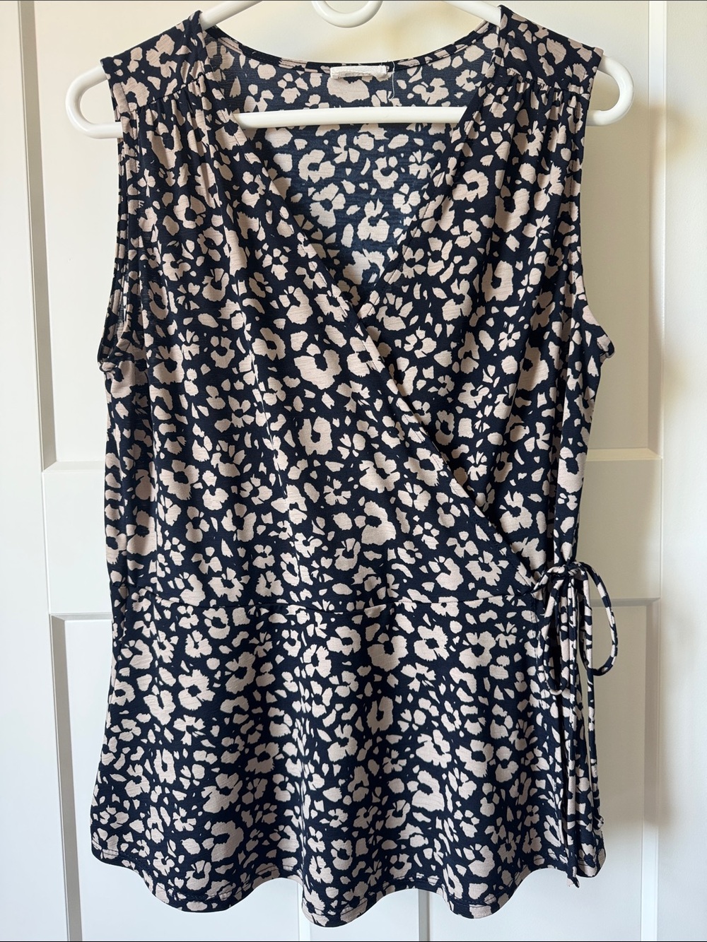 Sleeveless faux wrap blouse